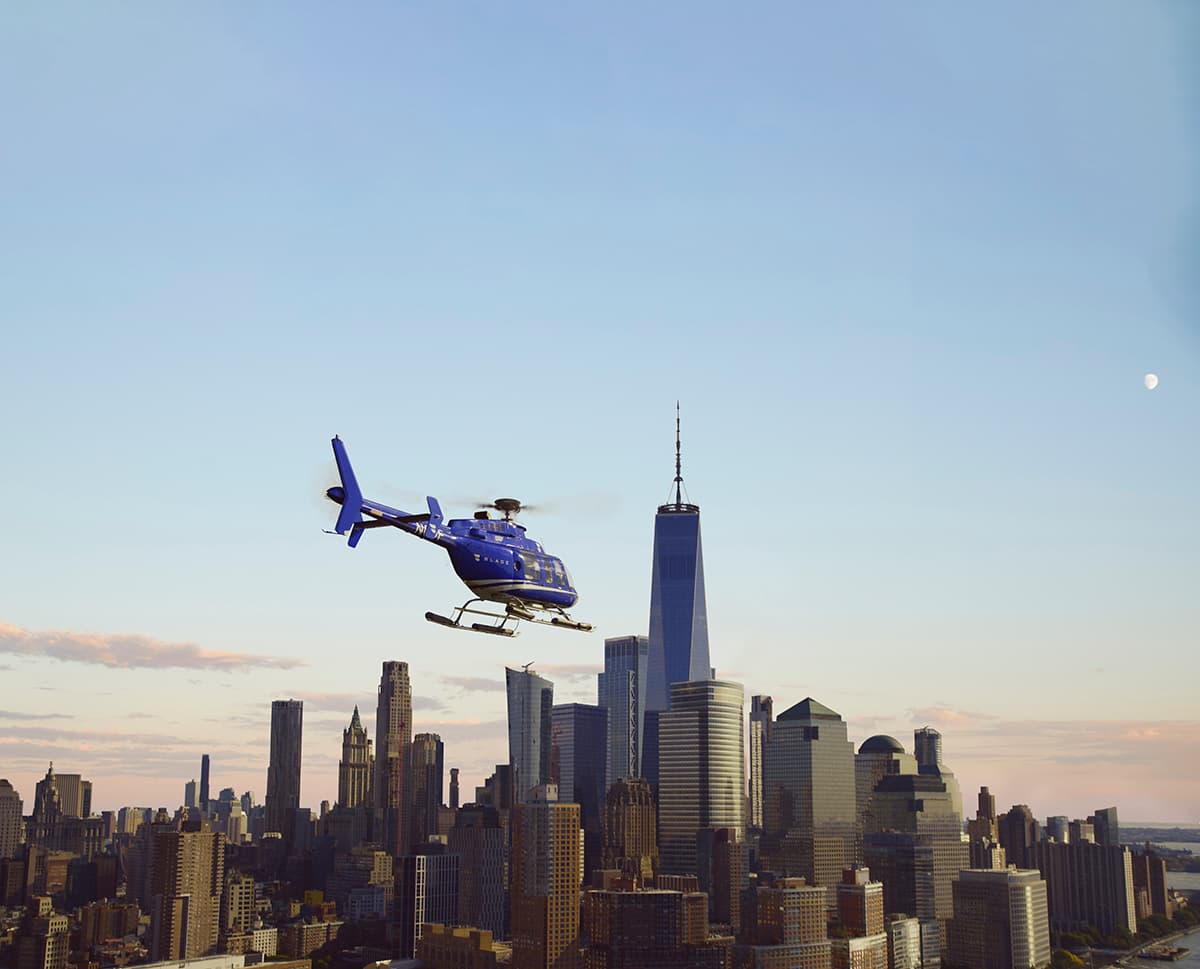 BLADE helicopter flying past the Lower Manhattan skyline