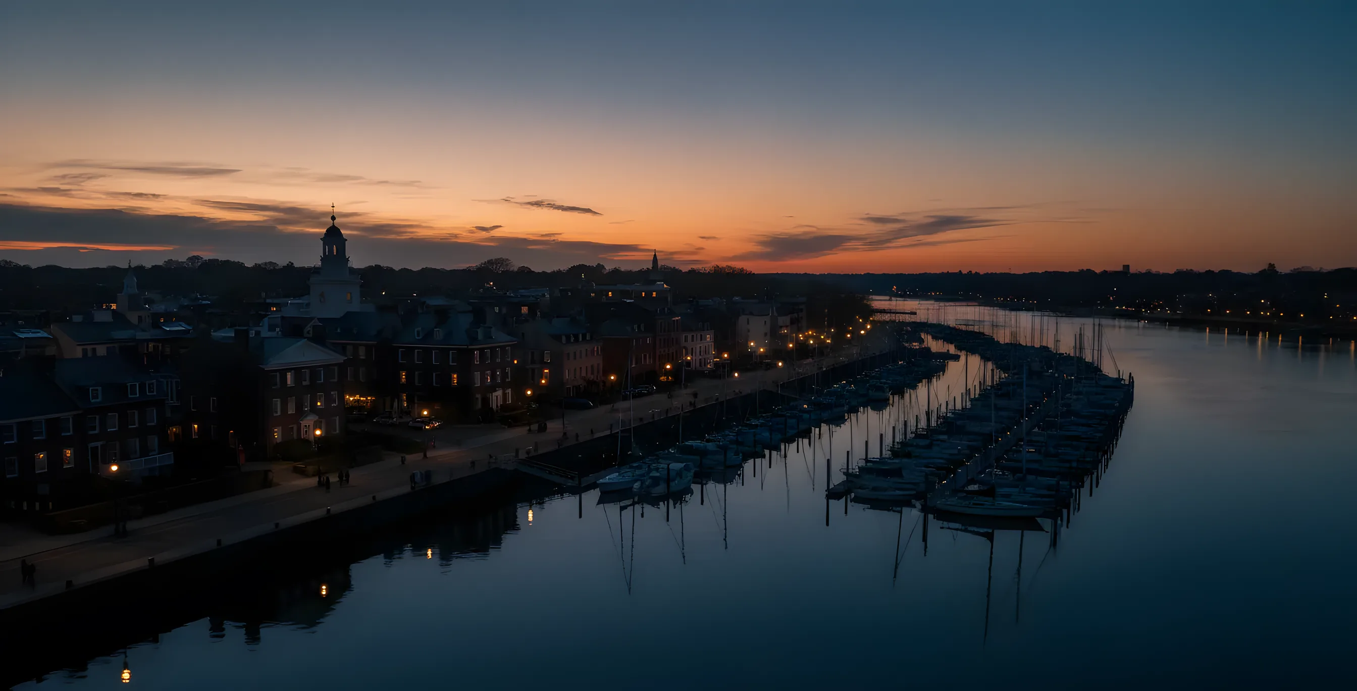 Aerial view of the Alexandria, Virginia waterfront and the Potomac River at sunrise.