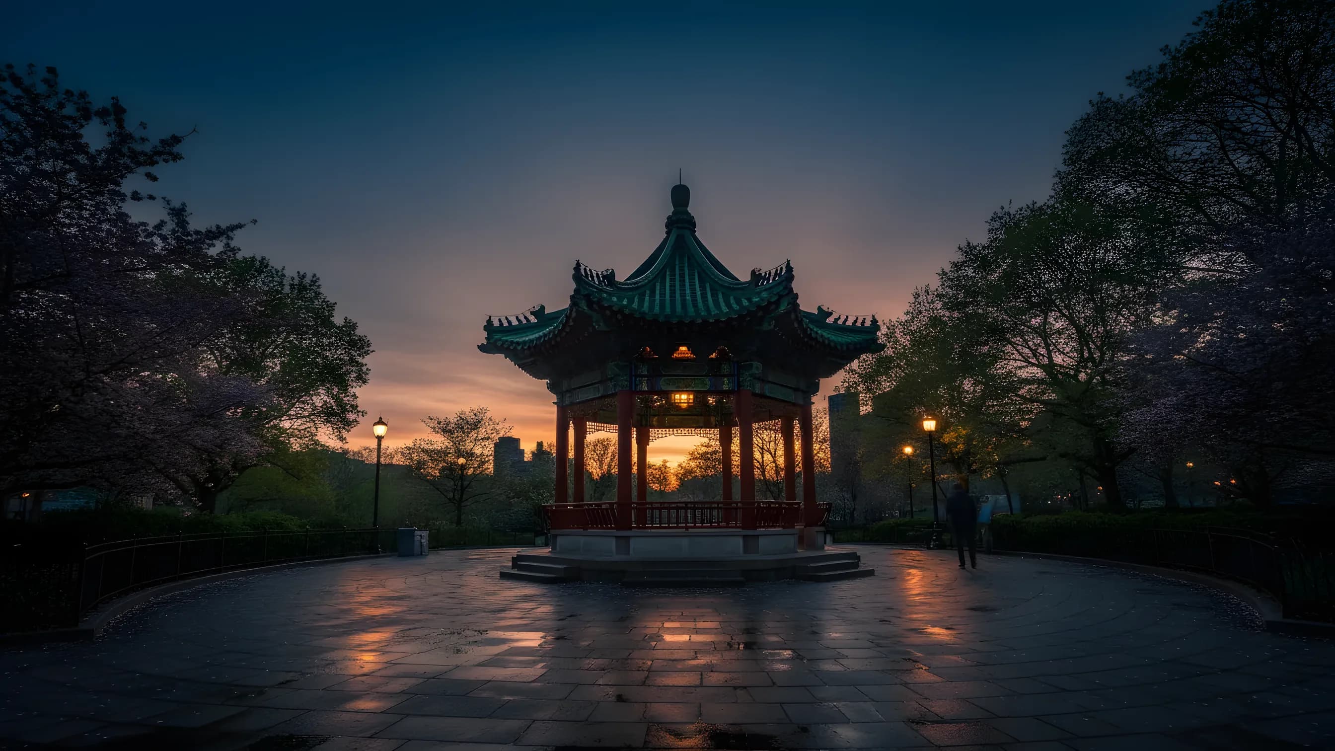 A traditional Chinese pavilion with an ornate roof in Columbus Park, NYC, on a clear day.