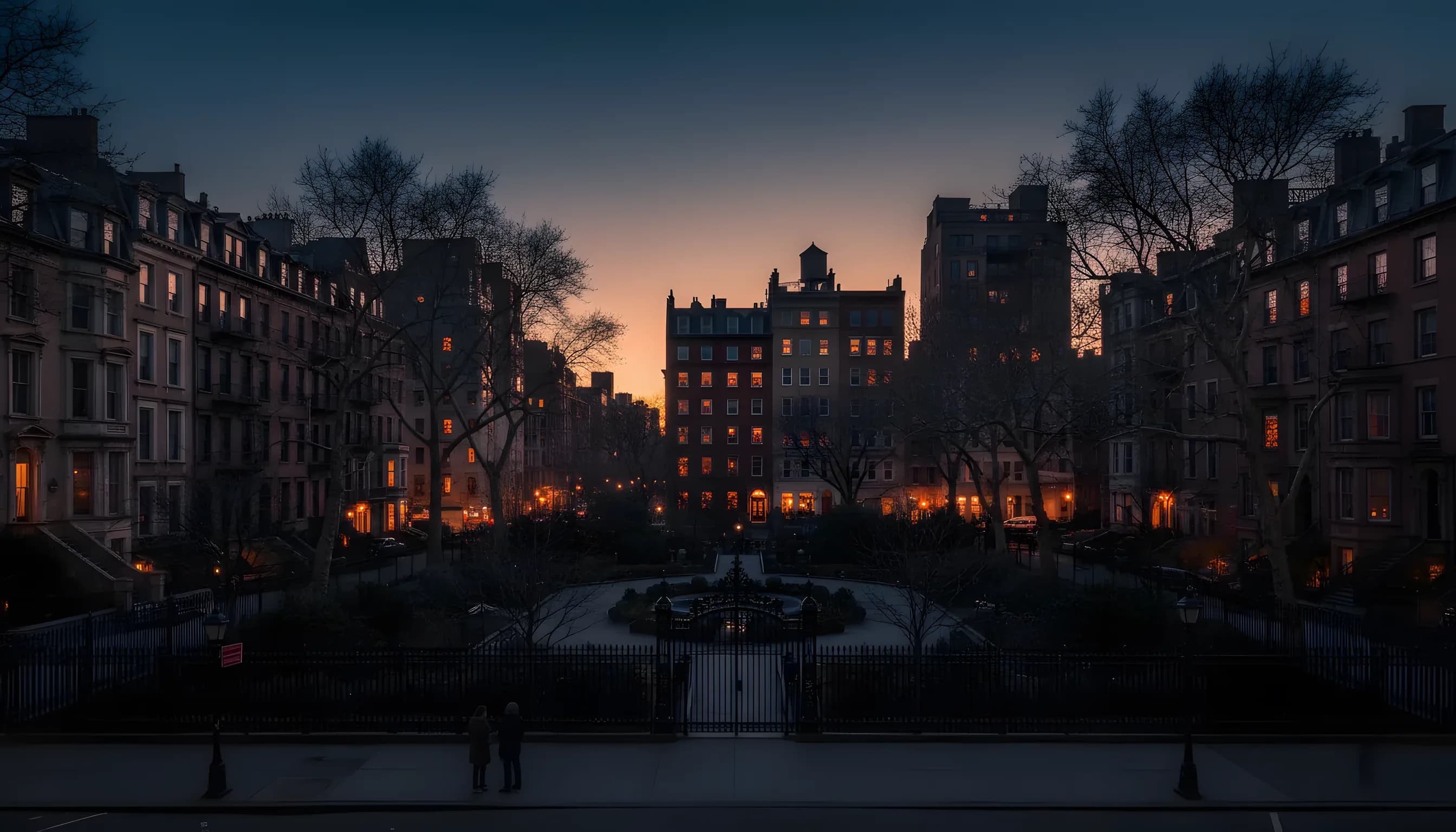Elegant historic buildings surrounding a private park in New York City at dusk.