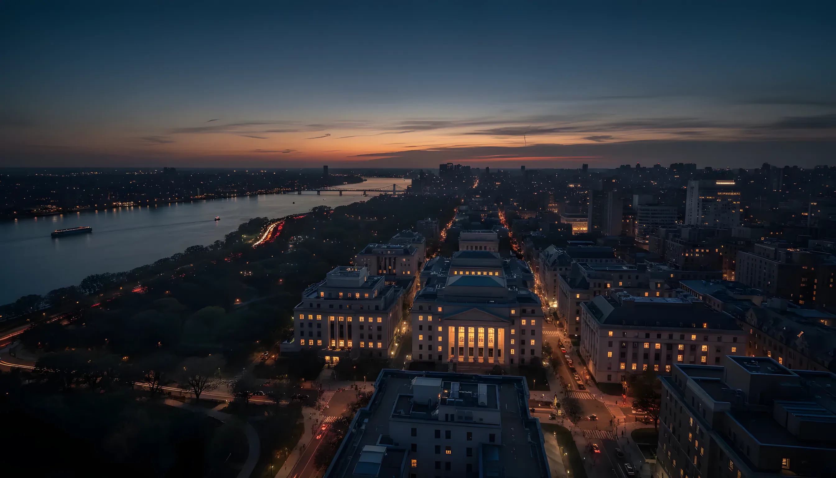 Aerial view of Morningside Heights and the Hudson River at twilight.