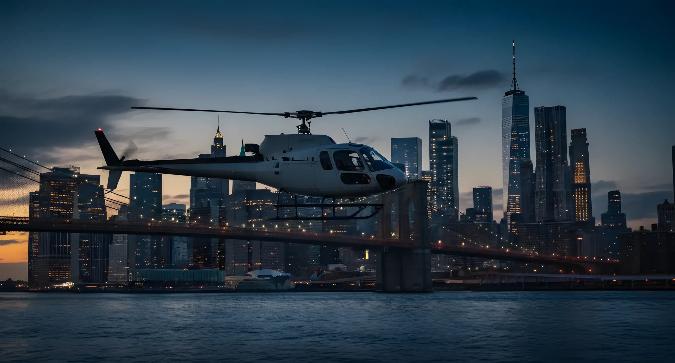 A helicopter in side profile over the East River with the Brooklyn Bridge and Lower Manhattan at blue hour.