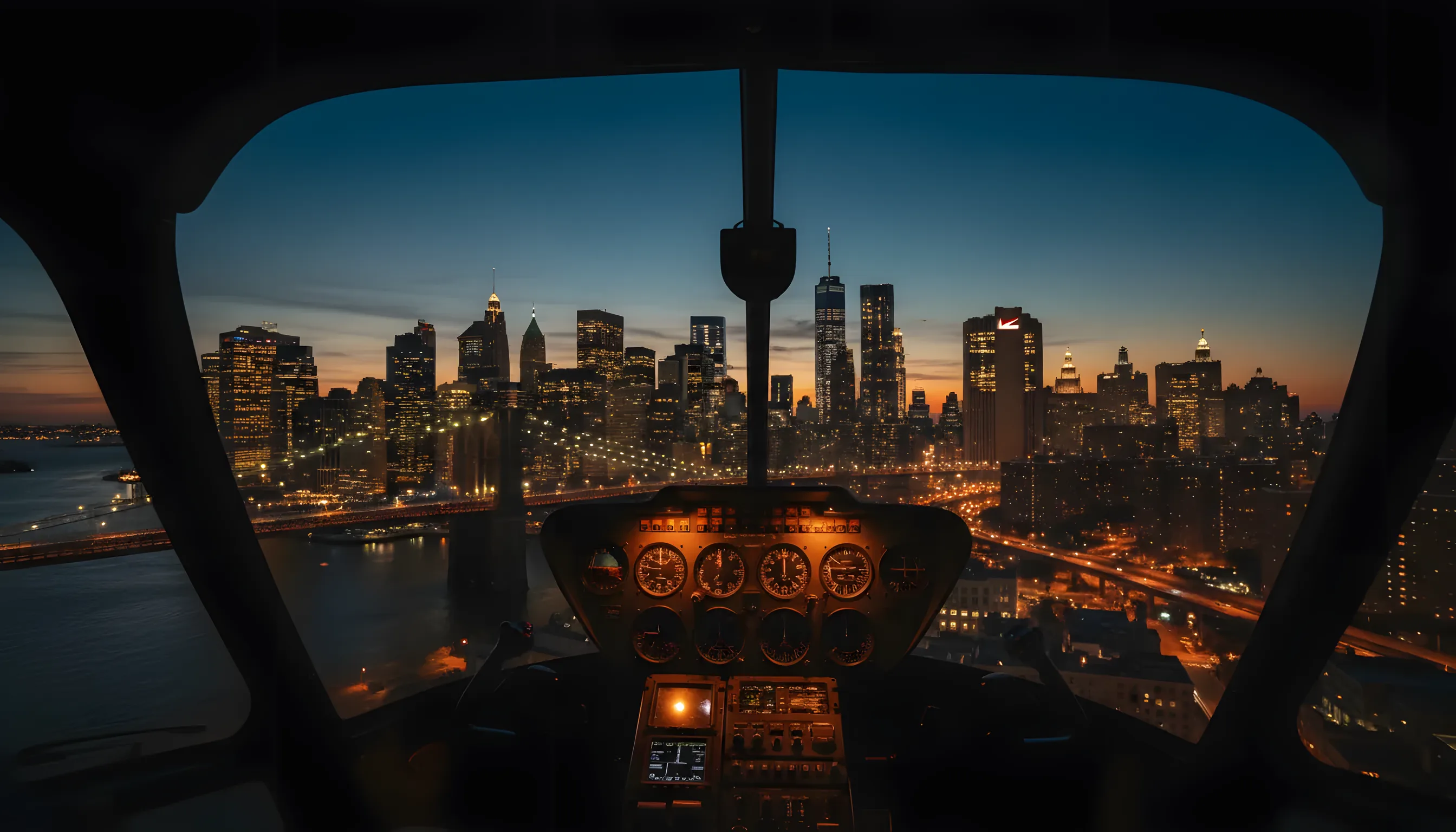 Aerial view of the Lower Manhattan skyline and Brooklyn Bridge at dusk from a helicopter cockpit.