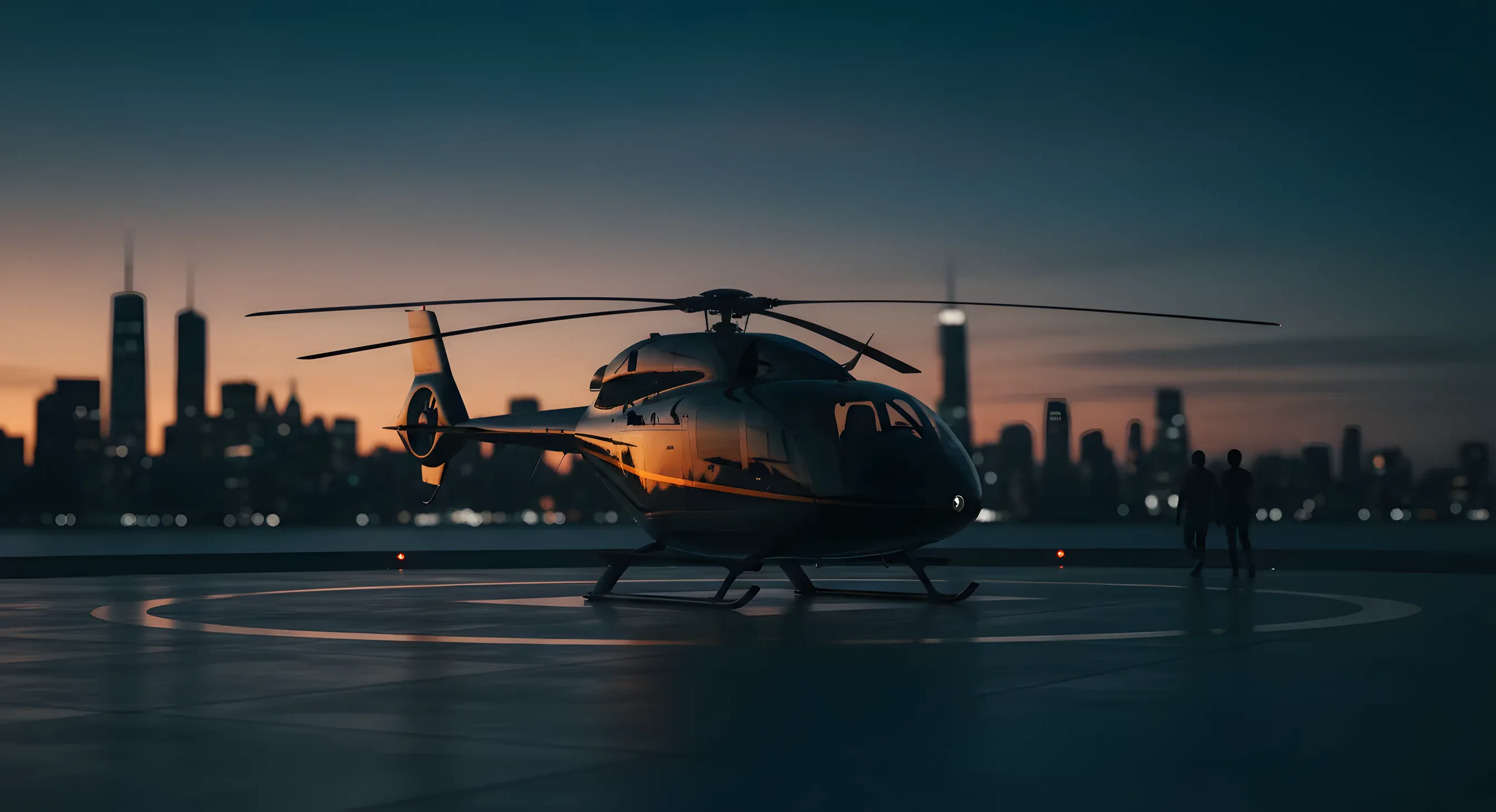 A helicopter on a helipad with the New York City skyline visible in the background at sunset.