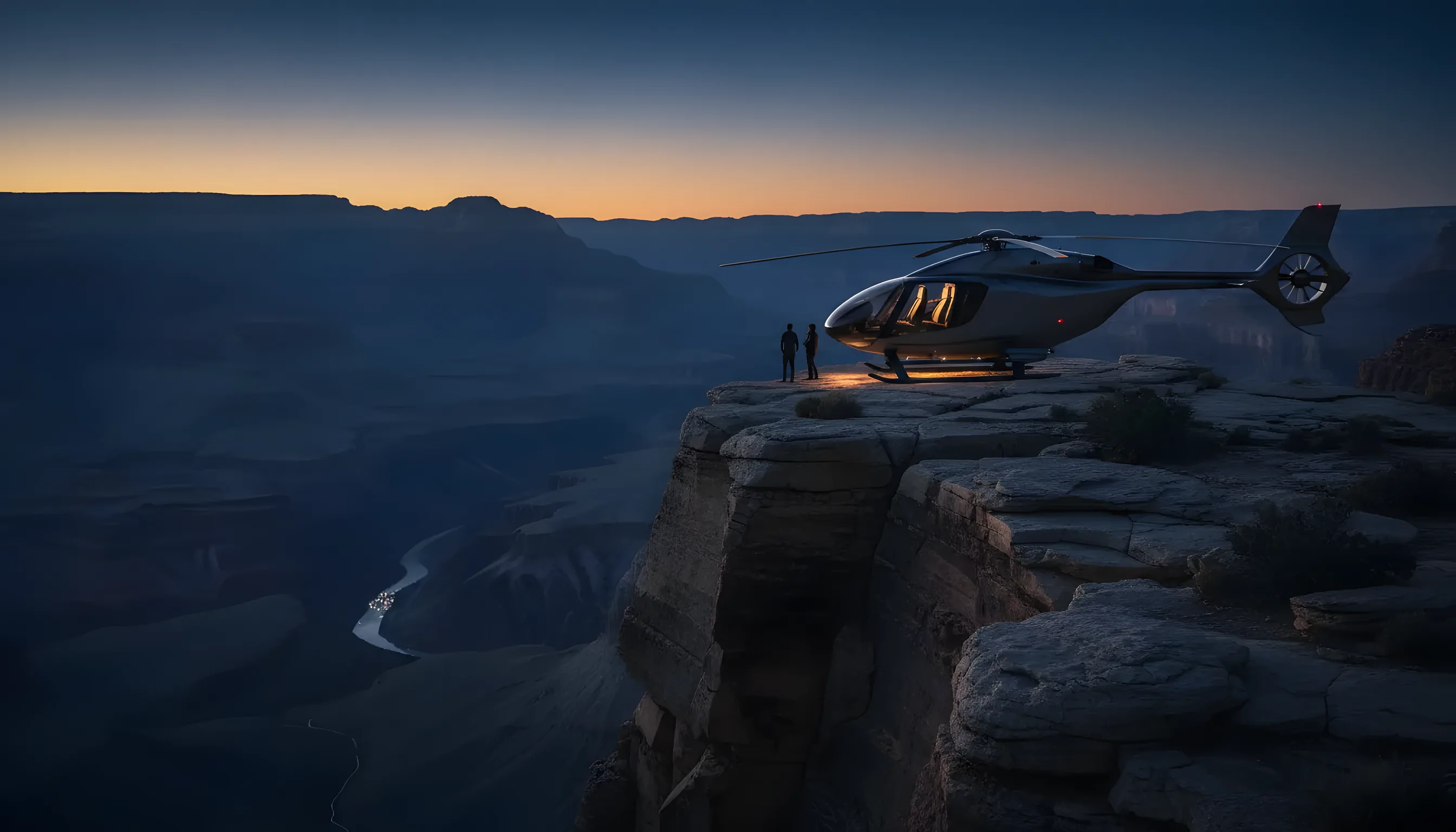 A helicopter parked on a cliff's edge at the Grand Canyon during a golden sunset.