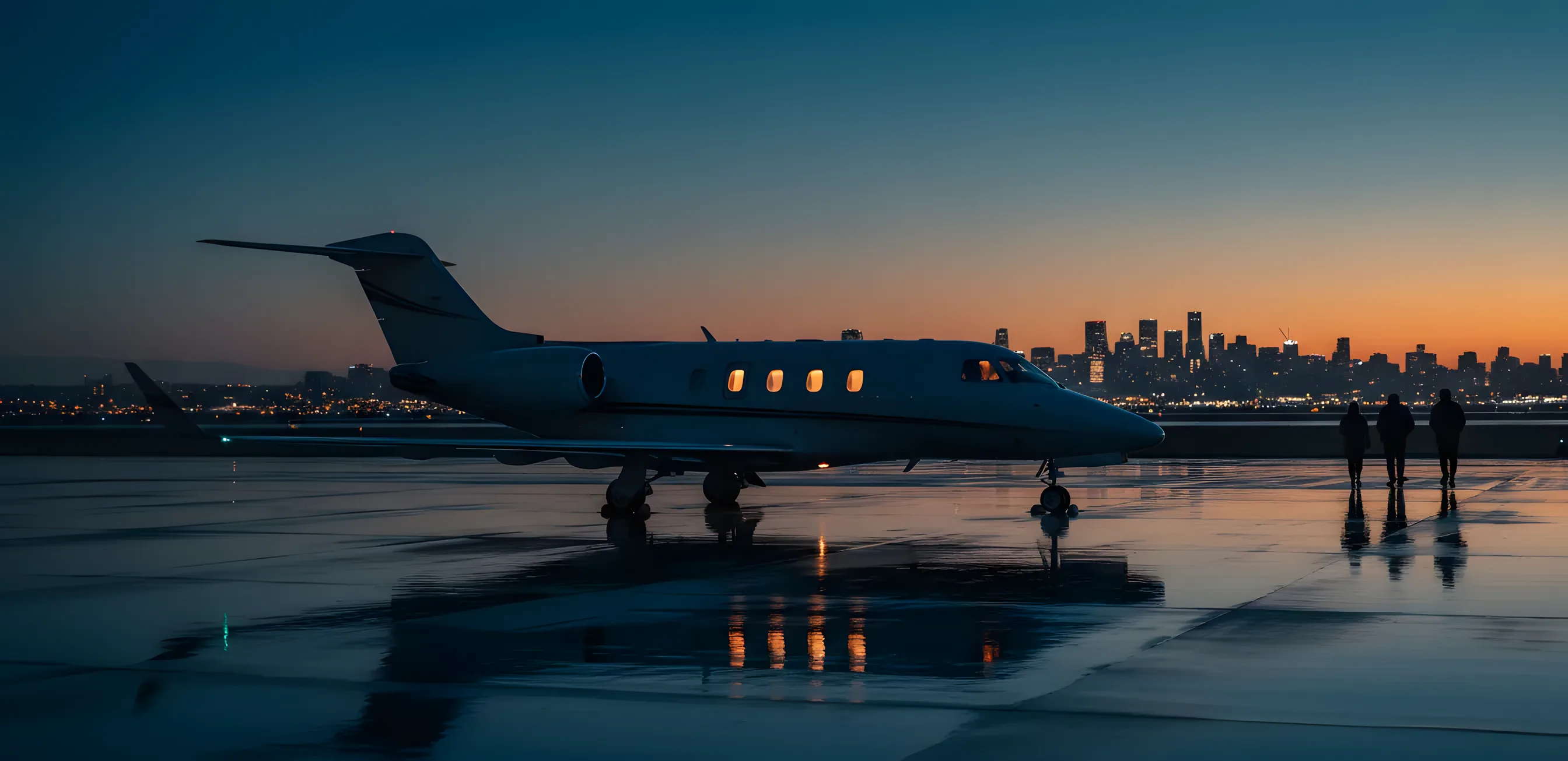 A private jet parked on a tarmac at dusk, with a glowing city skyline in the background.