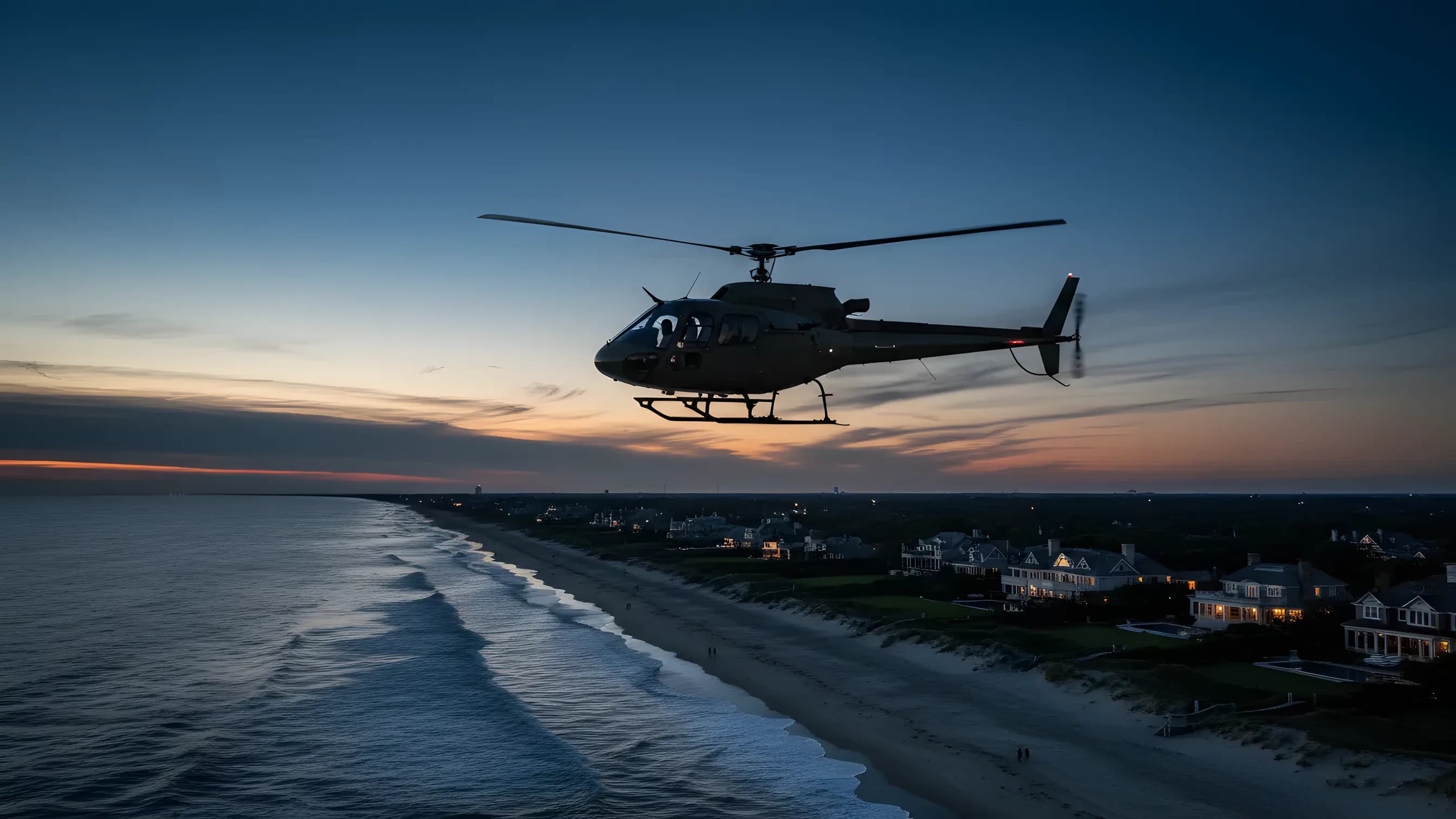 A helicopter flying over Hamptons beaches and dunes at golden hour.