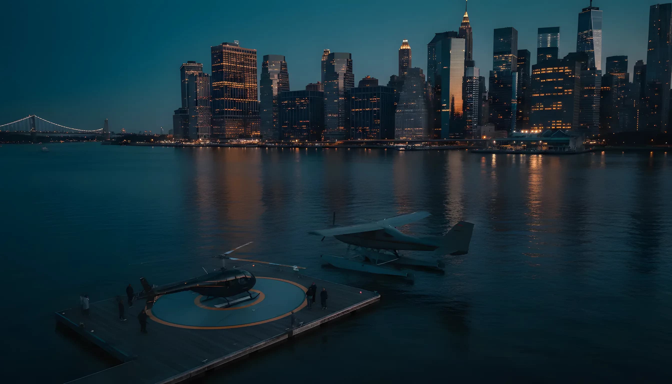 A seaplane and helicopter at a New York City waterfront terminal with the city skyline glowing at dusk.