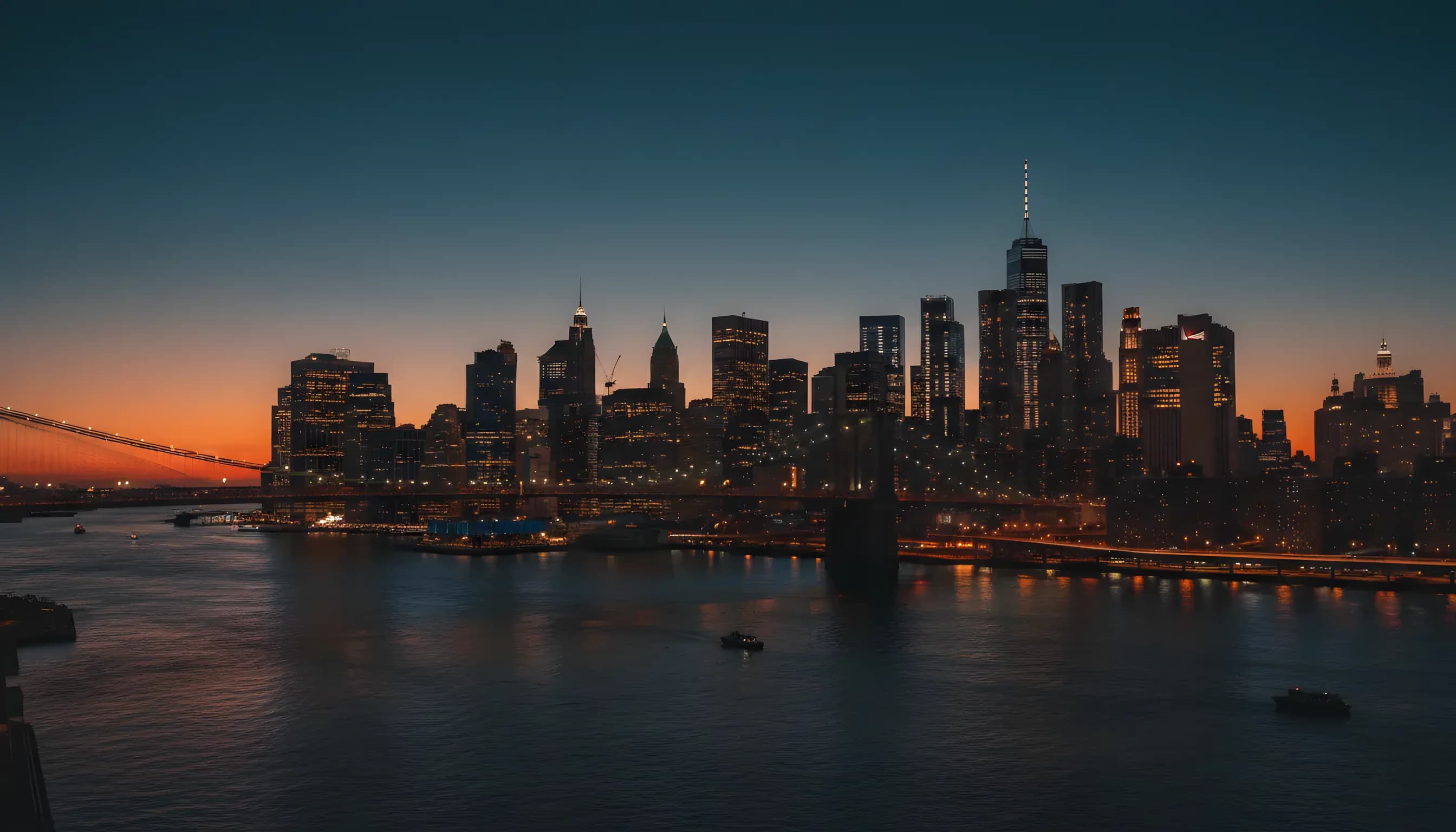 Aerial view of the Lower Manhattan skyline at dusk from a helicopter.